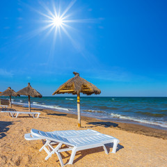 summer sea beach with umbrellas and chair