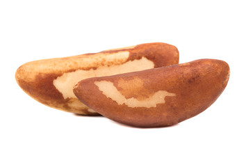 Two Brazil nuts isolated on white background
