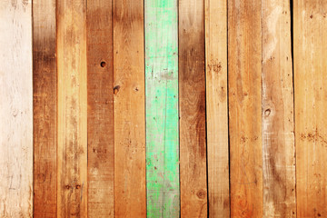 Fototapeta premium Ancient wood with cracked paint of green color
