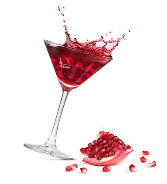 Pomegranate Fruit And Juice. Glass Of  Cocktail With Splash Isolated