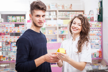Woman doctor and her client in front of the shop. Healthcare business