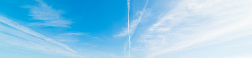 blue sky and contrails