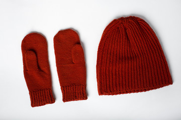 knitted hat with gloves red on a white background