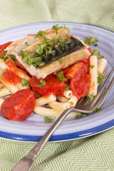 grilled mackerel with tagliatelle on a plate