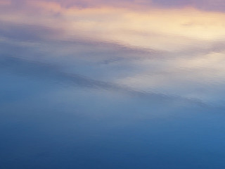 Fototapeta na wymiar Abstract background of sunrise sky reflection on water surface.