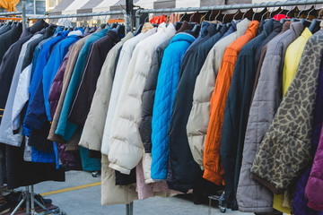 Various style winter cloth on rack in winter shop