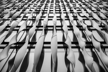  Abstract detail of the aluminium fins decorating the front  facade of a building - obrazy, fototapety, plakaty