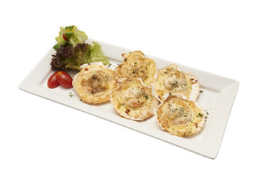 Isolated of baked scallop with cheese in white plate. Clipping path and white background.