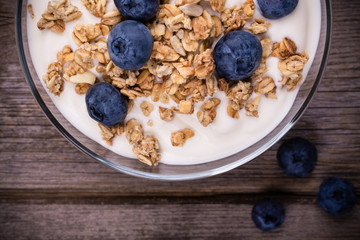 Yogurt with granola and blueberries.