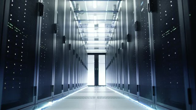 Camera Moves Through Big Working Data Center with Server Racks and Glass Ceiling.  Shot on RED EPIC-W 8K Helium Cinema Camera.