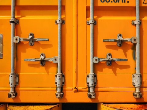 Yellow Rusty Container Door On Yard, Yellow Background