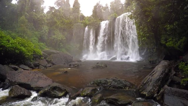 Waterfall in rainforest. Overcast weather. Phnom Kulen Park, Cambodia