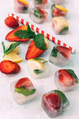 Fresh homemade ice cubes with fruits. Summer fresh drink