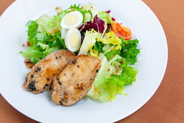 Caesar salad in white plate