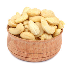 Fototapeta premium cashew in wood plate isolated on white background
