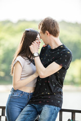 Fototapeta premium Inlove couple taking a walk in the park. Lifestyle and relationship. Young inlove boyfriend and girlfriend