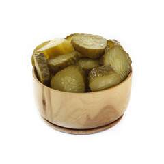 salted cucucmbers in wooden cup isolated