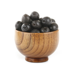 black olives in wooden cup isolated