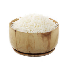 Dried grated coconut in wooden cup isolated on white background