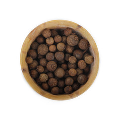allspice in wooden cup isolated