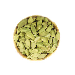 green cardamom in wooden cup isolated