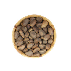 cedarnuts in wooden cup isolated