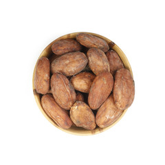 cacao beans in wooden background isolated