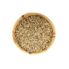 cumin in wooden cup isolated