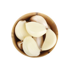 garlic in wooden cup isolated on while