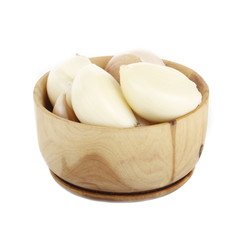 garlic in wooden cup isolated on while