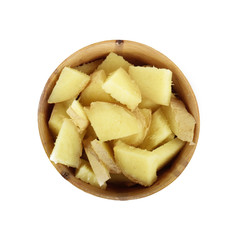 slices of ginger in wooden cup isolated