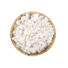 Dried grated coconut in wooden cup isolated on white background