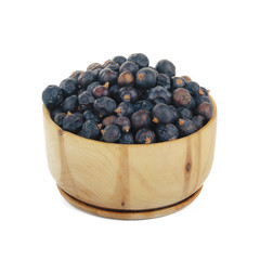 juniper berries in wooden cut isolated