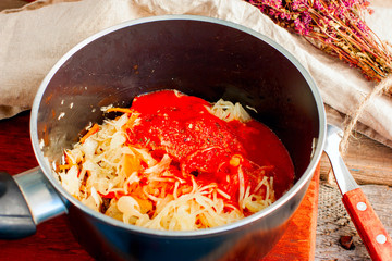 Tomato soup with sausages and cabbage, the process of cooking