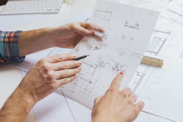Hands of architects with sketch