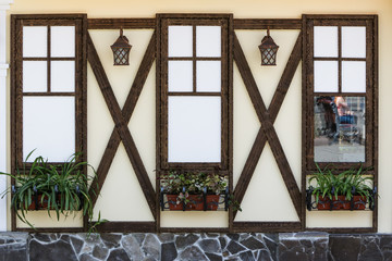 The wall of the house with Windows.