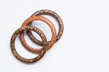 Wooden bracelets on white background