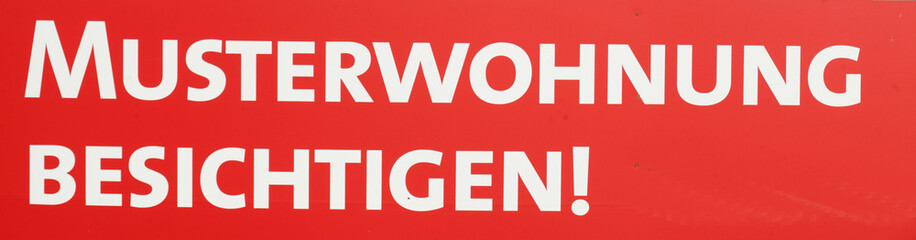 Rotes Schild  Musterwohnung besichtigen