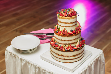 Wedding cake at the Banquet. Cutlery.