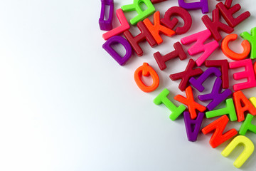 Wooden colored letters on a white background.