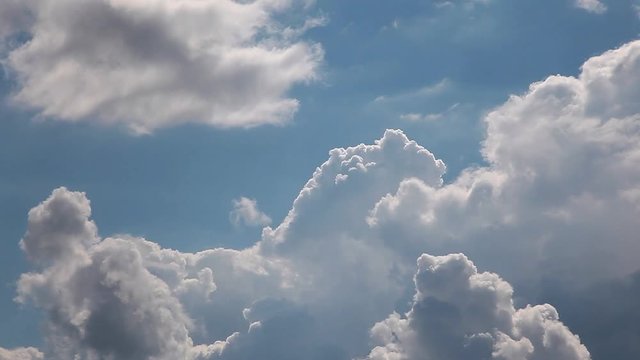 Timelapse of cumulus clouds forming on a clear blue sky