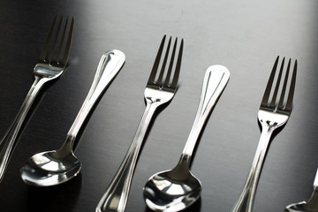 Cutlery on a black background. Fork, spoon, knife.