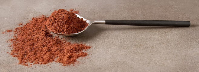 Natural cocoa powder for chocolate and baking. Copy space. Horizontal photo.