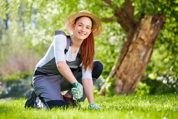 Young woman working in the garden