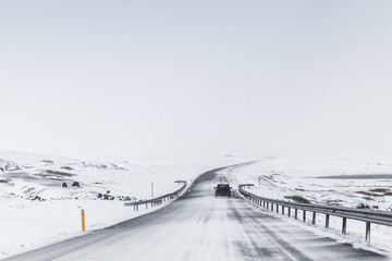 Icelandic road covered with snow, rural winter