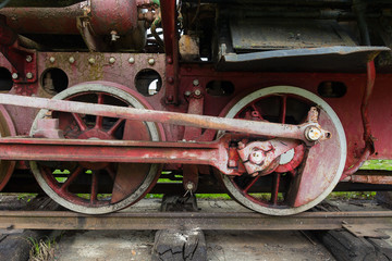 Fototapeta na wymiar Mechanical part and wheels of the retro steam locomotive