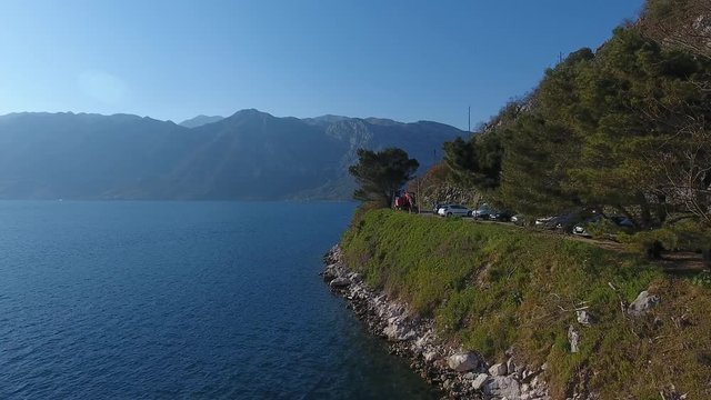 Aerial view of the seashore landscape of Perast with mountain road, Montenegro