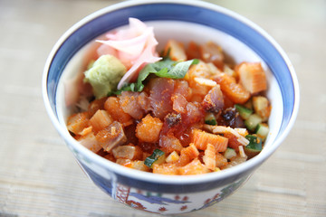 Sushi don , raw sushi salmon tuna octopus and egg on rice , Japanese food