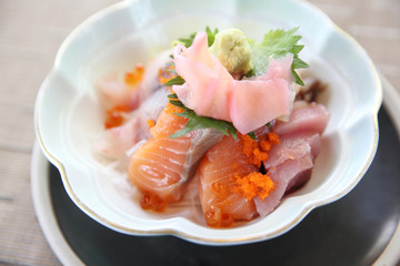 Sushi don , raw sushi salmon tuna octopus and egg on rice , Japanese food