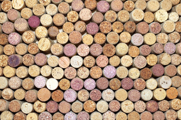Wine corks background horizontal / used wine corks / many wine corks / closeup of a wall of used wine corks